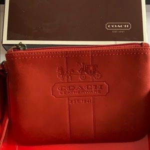 Deep red Coach leather wristlet